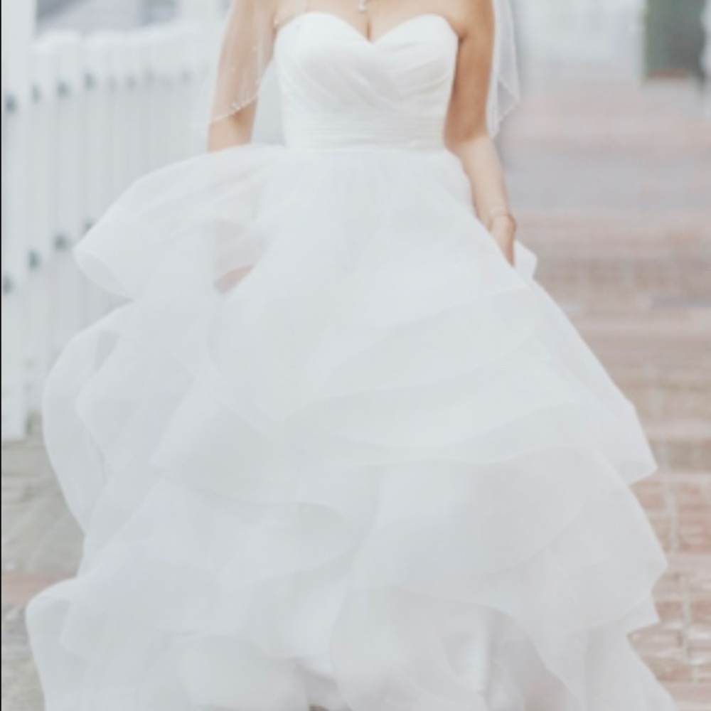 Beautiful dreamy wedding dress with layers of ruffles throughout
